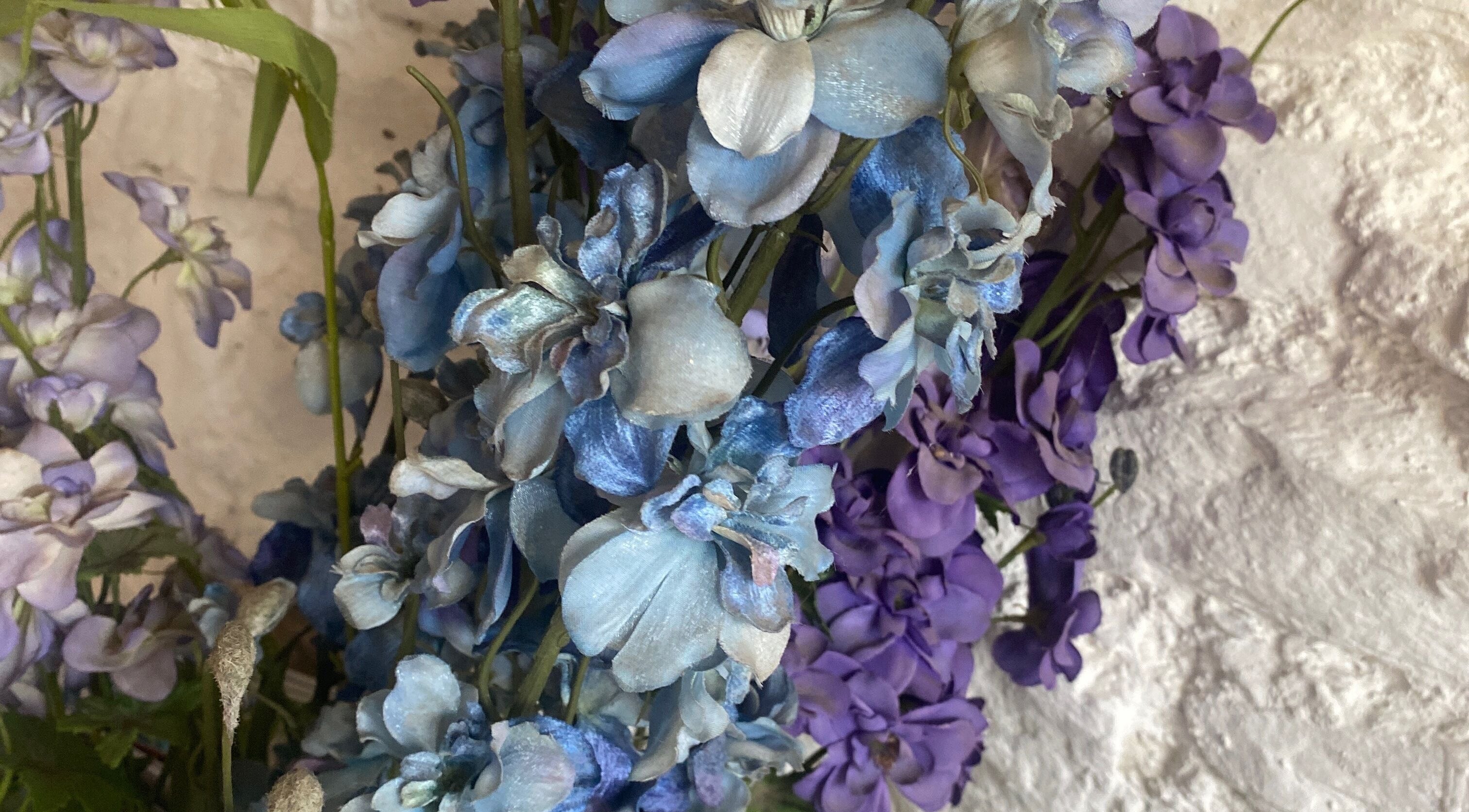 Vibrant blue and purple flowers at Lesley CJ Hair in Belvedere, England, GB.