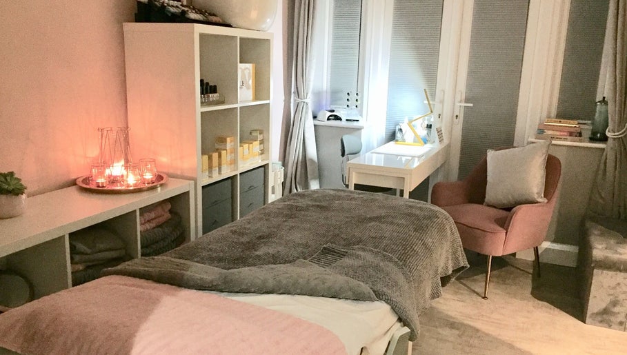 Tranquil spa room at LHB, London Colney, England, GB, featuring candles, plush seating, and a serene atmosphere.