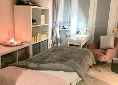 Tranquil spa room at LHB, London Colney, England, GB, featuring candles, plush seating, and a serene atmosphere.