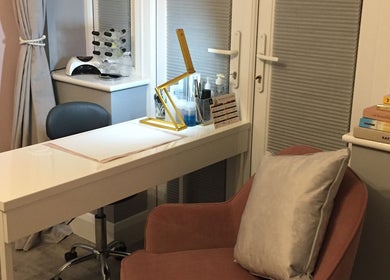 Chic beauty salon setup at LHB in London Colney, England, GB with a modern desk and comfy chair.