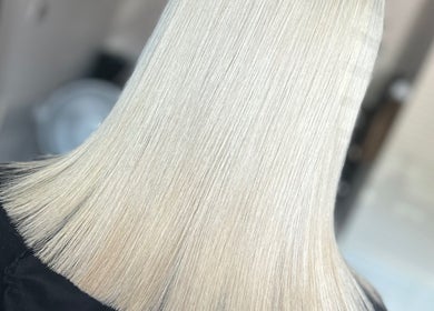 Sleek platinum blonde bob at Amy Jane Hairdressing, Stafford, England, GB. Perfectly executed haircut.