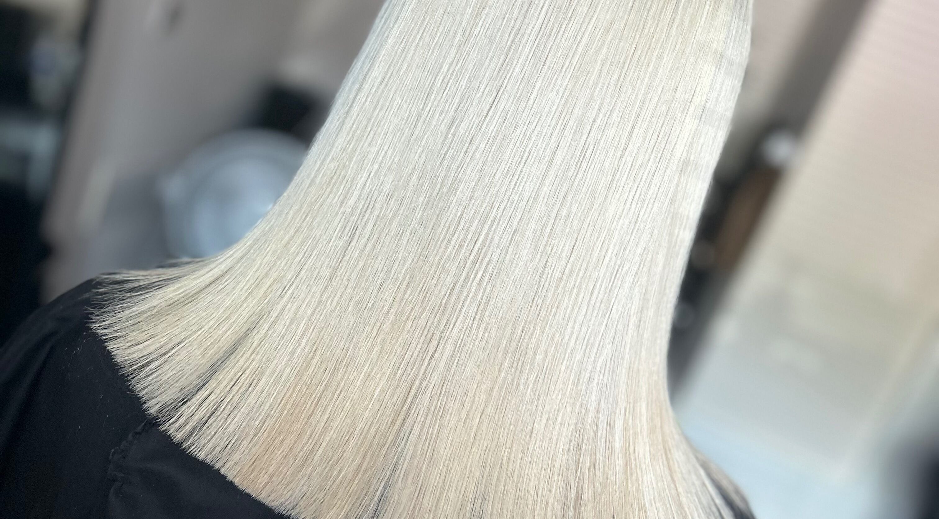 Sleek platinum blonde bob at Amy Jane Hairdressing, Stafford, England, GB. Perfectly executed haircut.