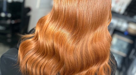 Flowing ginger hair styled at Amy Jane Hairdressing in Stafford, England, GB. Shiny, smooth waves on display.