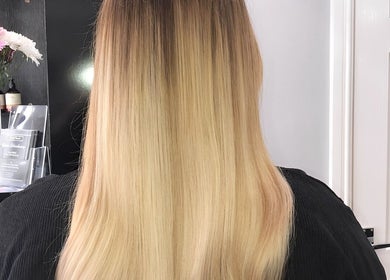 Vertical view of sleek blonde hair styled by Amy Jane Hairdressing in Stafford, England, GB.