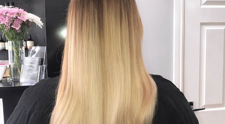 Vertical view of sleek blonde hair styled by Amy Jane Hairdressing in Stafford, England, GB.
