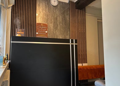 Reception area at King Thai Therapy Knowle with warm decor, located in Knowle, England, GB.