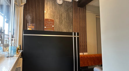 Reception area at King Thai Therapy Knowle with warm decor, located in Knowle, England, GB.
