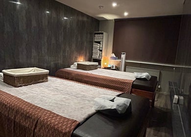 Relaxing massage room at King Thai Therapy Knowle, Knowle, England, GB, featuring two massage tables.