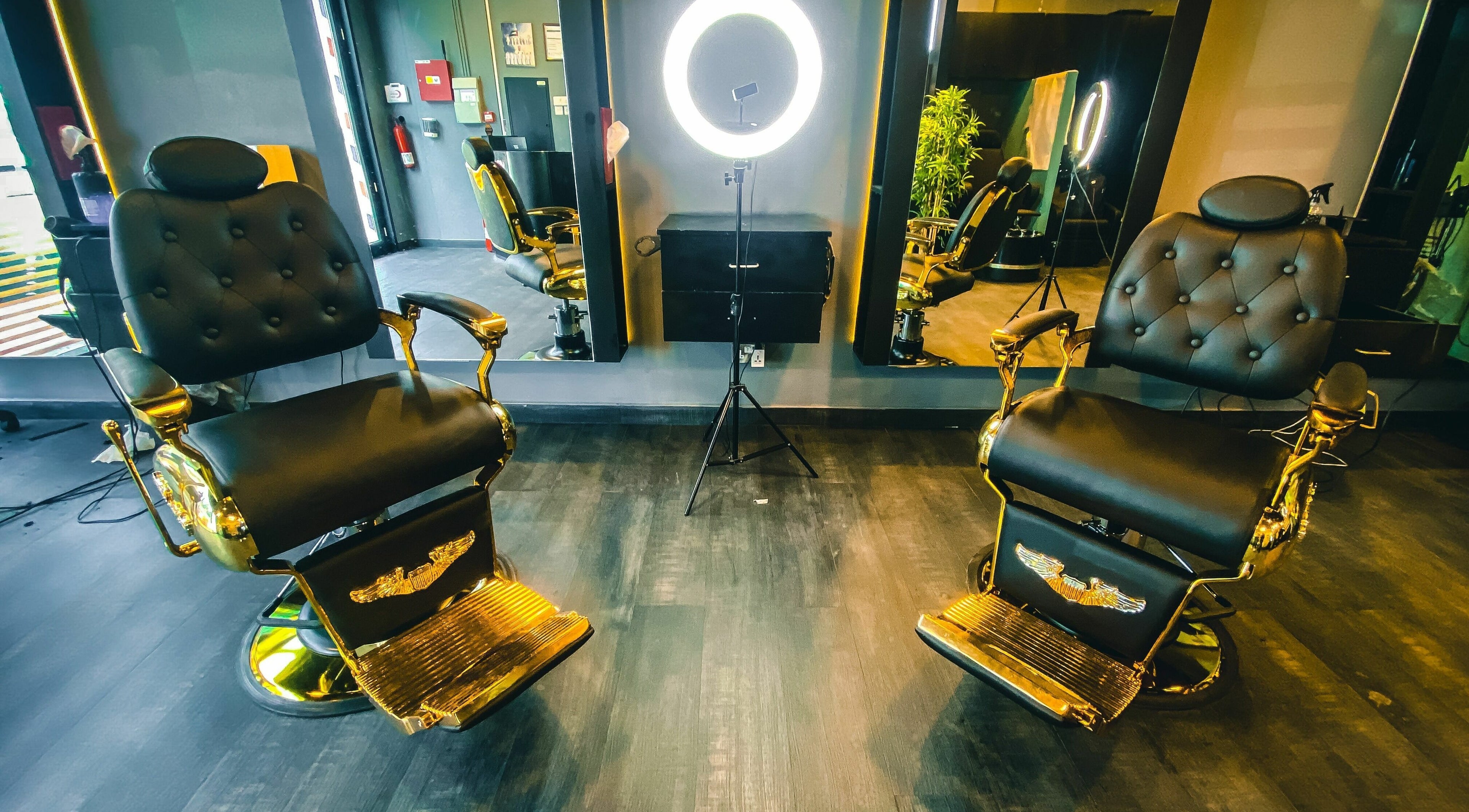 Elegant barber chairs at Spritz Gents Salon - Al Karama, Dubai, AE, with stylish interior and modern lighting.