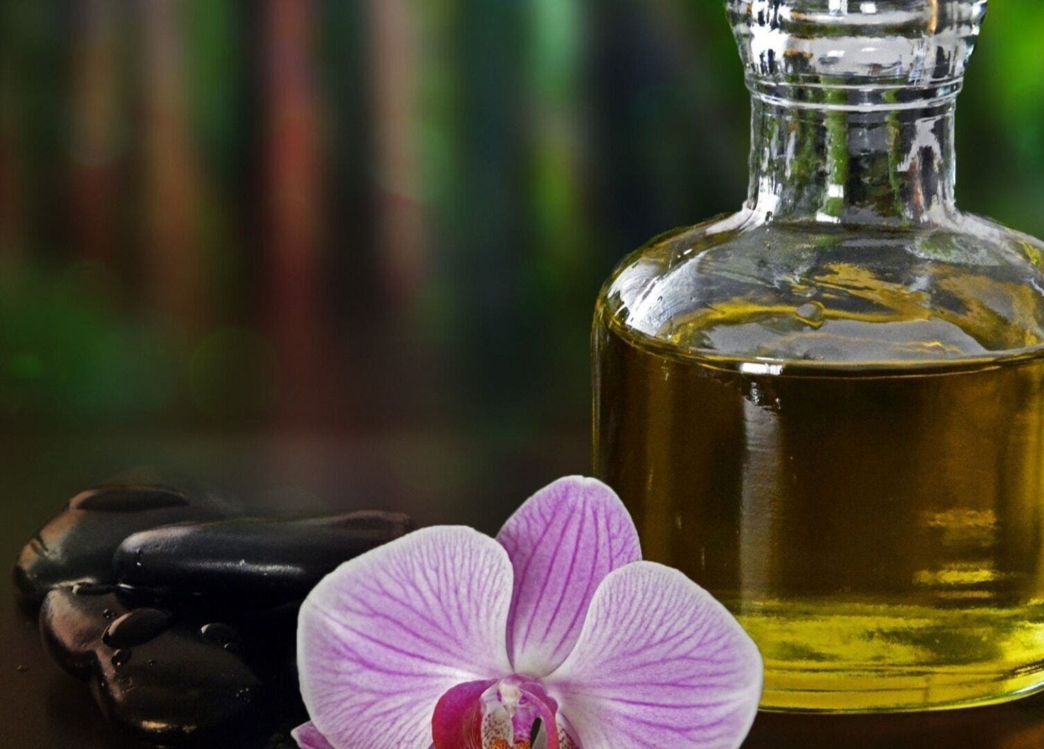 Aromatherapy oil and orchid at Halo Grooming Studio, Cape Town, Western Cape, ZA for ultimate relaxation.