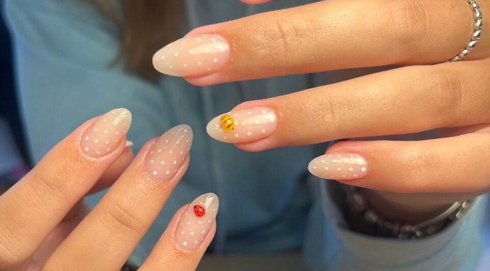 Polkadot designed nails with bee and ladybug art at TH Beauty, Cannock, England, GB.