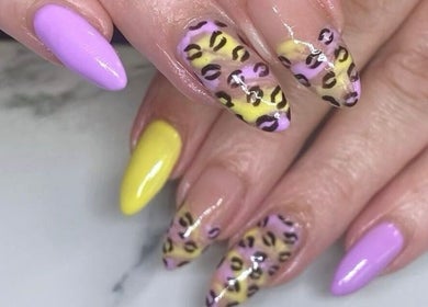 Unique leopard print nail art with vibrant colors at Colour Boutique in Christchurch, Canterbury Region, NZ.