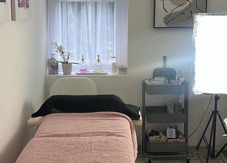 Cozy treatment room at Elegance Lash and Brow Studio, Falmouth, England, GB with soft lighting and plush decor.