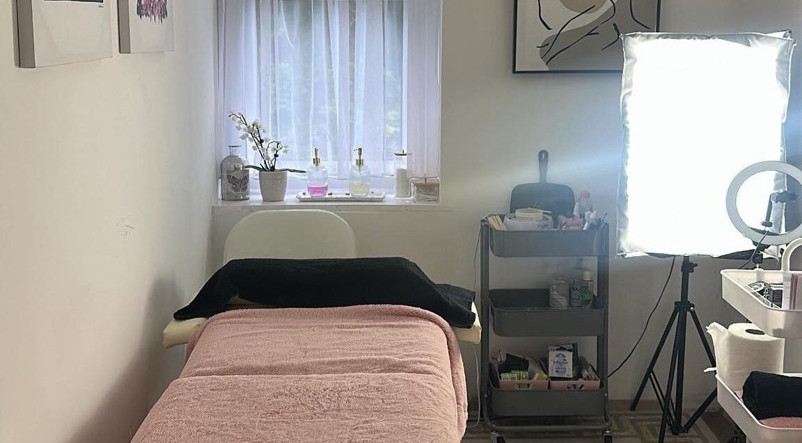 Cozy treatment room at Elegance Lash and Brow Studio, Falmouth, England, GB with soft lighting and plush decor.