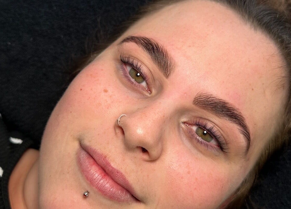 Client with defined brows and lashes at Elegance Lash and Brow Studio, Falmouth, England, GB.