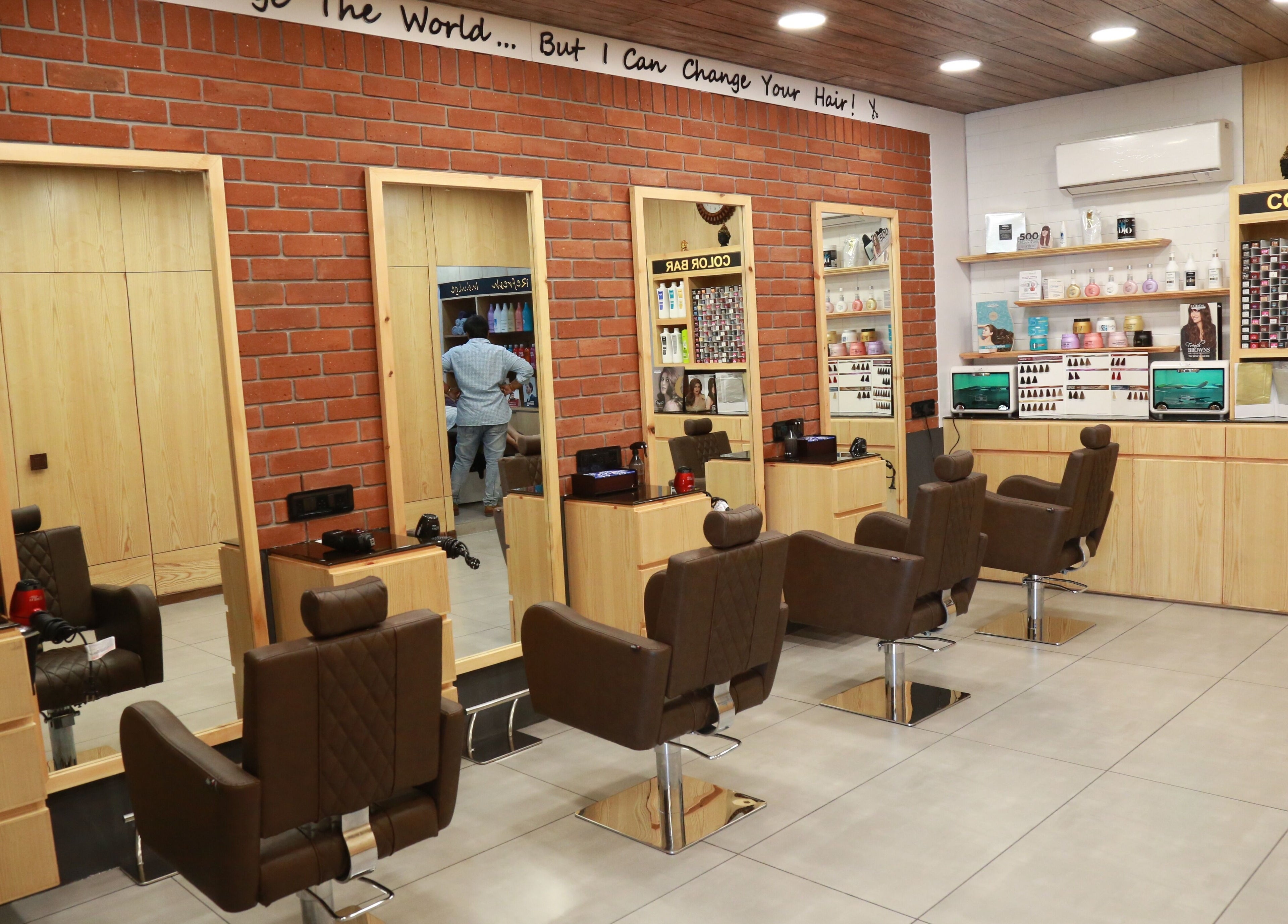 Modern interior of J and K Signature Unisex Salon in Anand, Gujarat, IN, featuring stylish salon chairs and mirrors.
