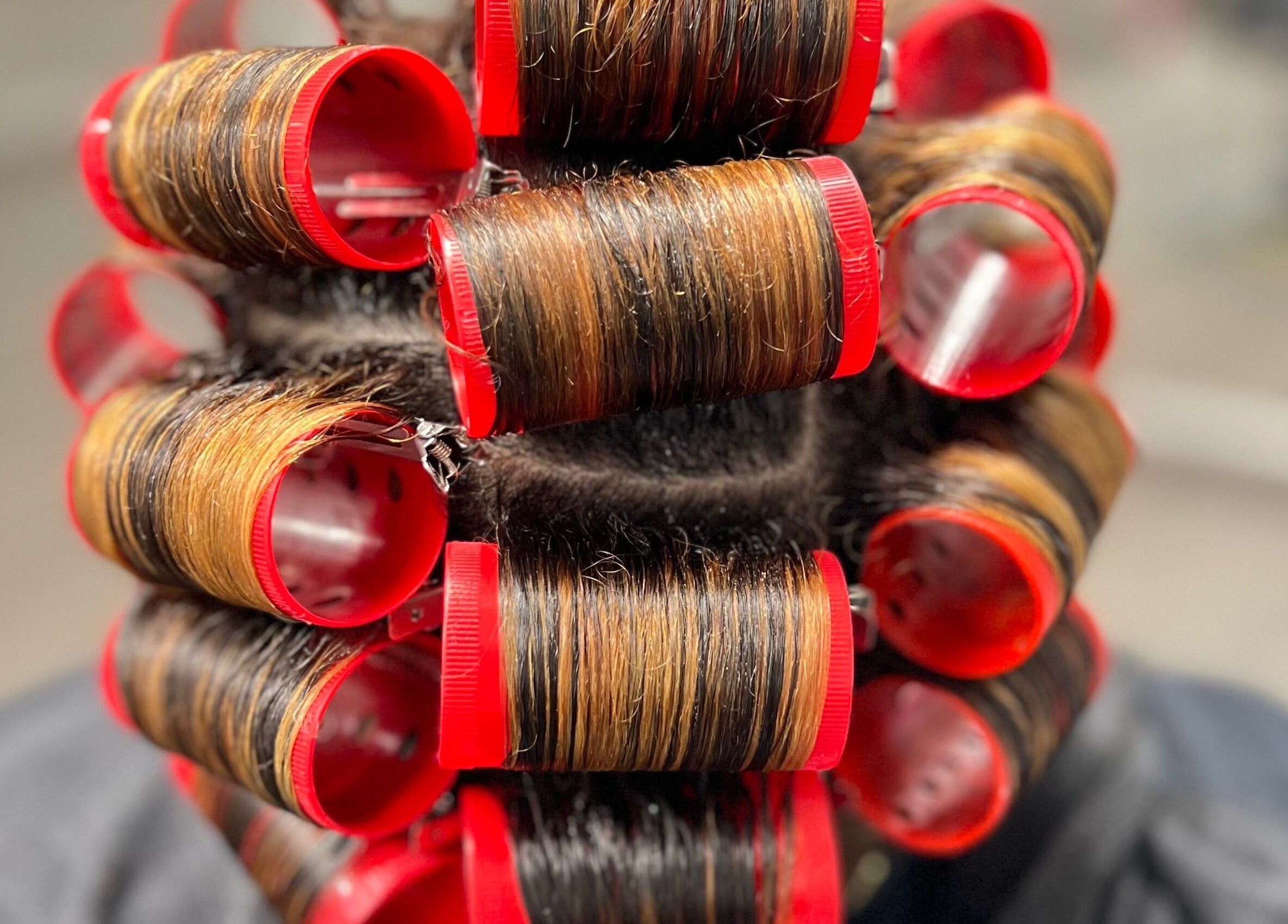 Hair styled in curlers at Angelica Johnson, Shreveport, Louisiana, US for a perfect hairdo.