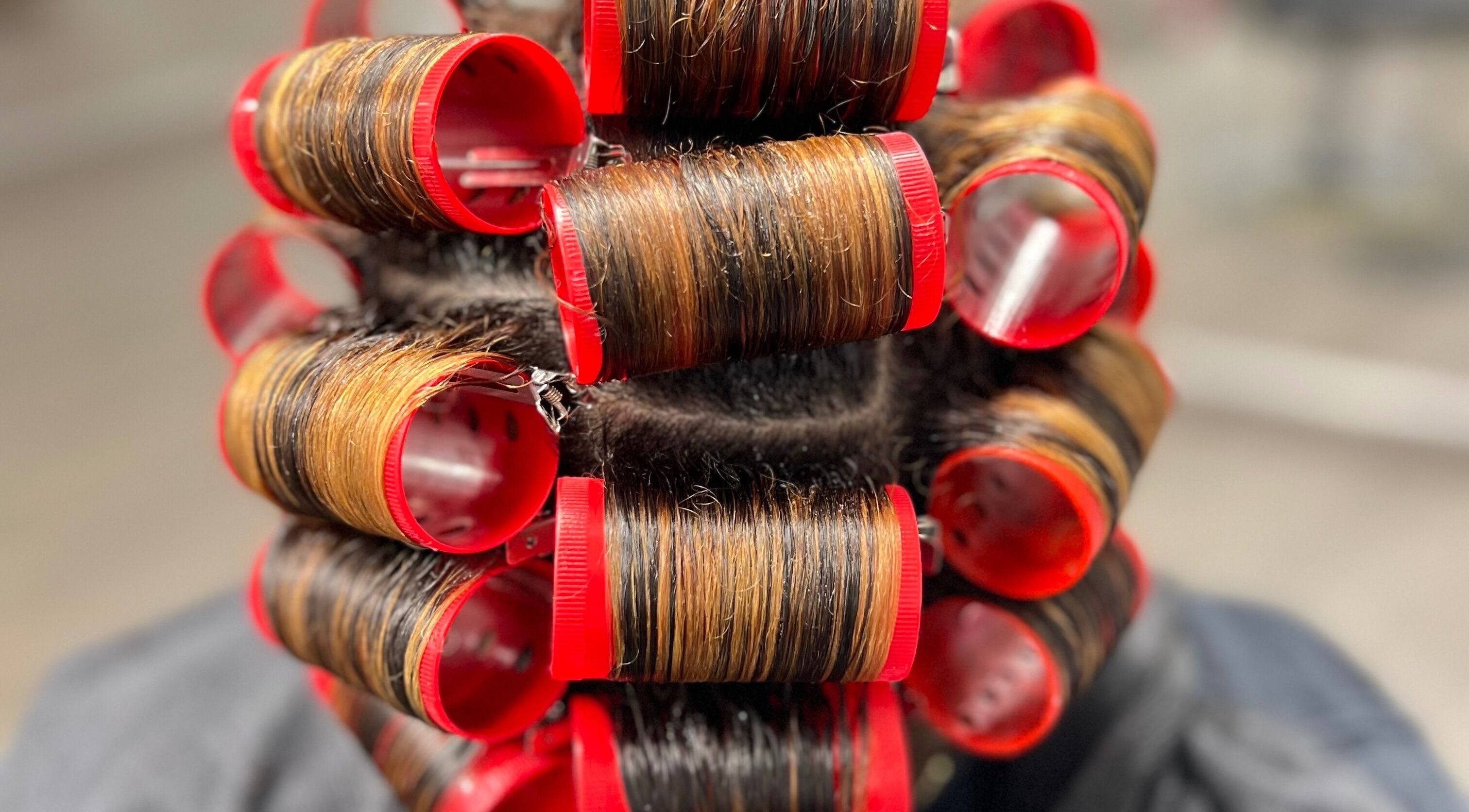 Hair styled in curlers at Angelica Johnson, Shreveport, Louisiana, US for a perfect hairdo.
