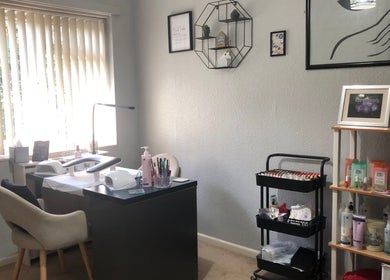 Cozy nail care station at Taurus Beauty in Sutton Coldfield, England, GB with modern decor and daylight view.