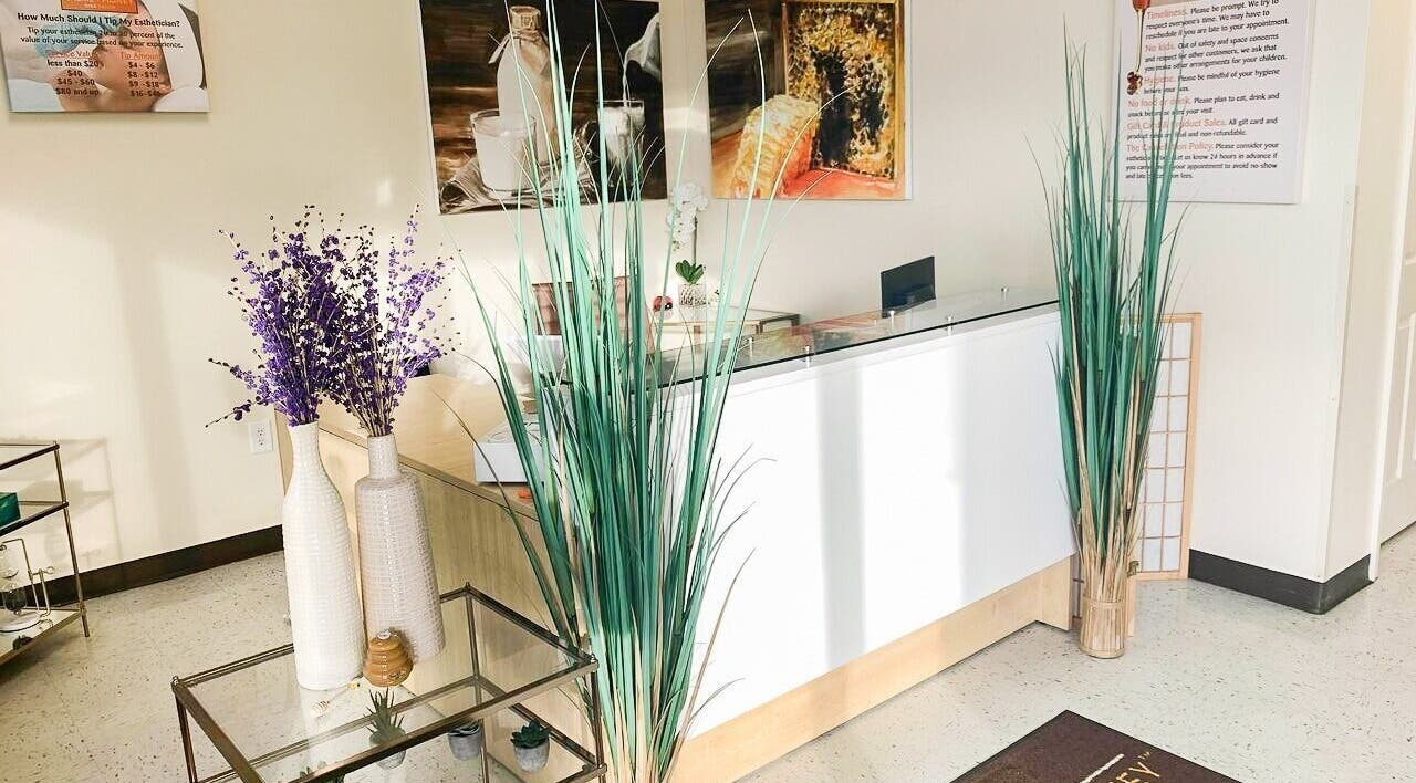 Reception area at Creme + Honey Wax Salon in Fayetteville, North Carolina, US with stylish decor.