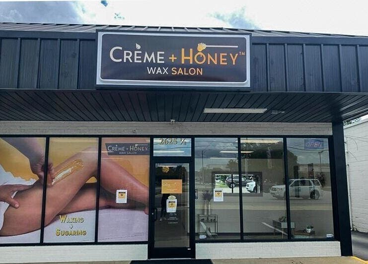 Exterior view of Creme + Honey Wax Salon in Fayetteville, North Carolina, US featuring storefront window.