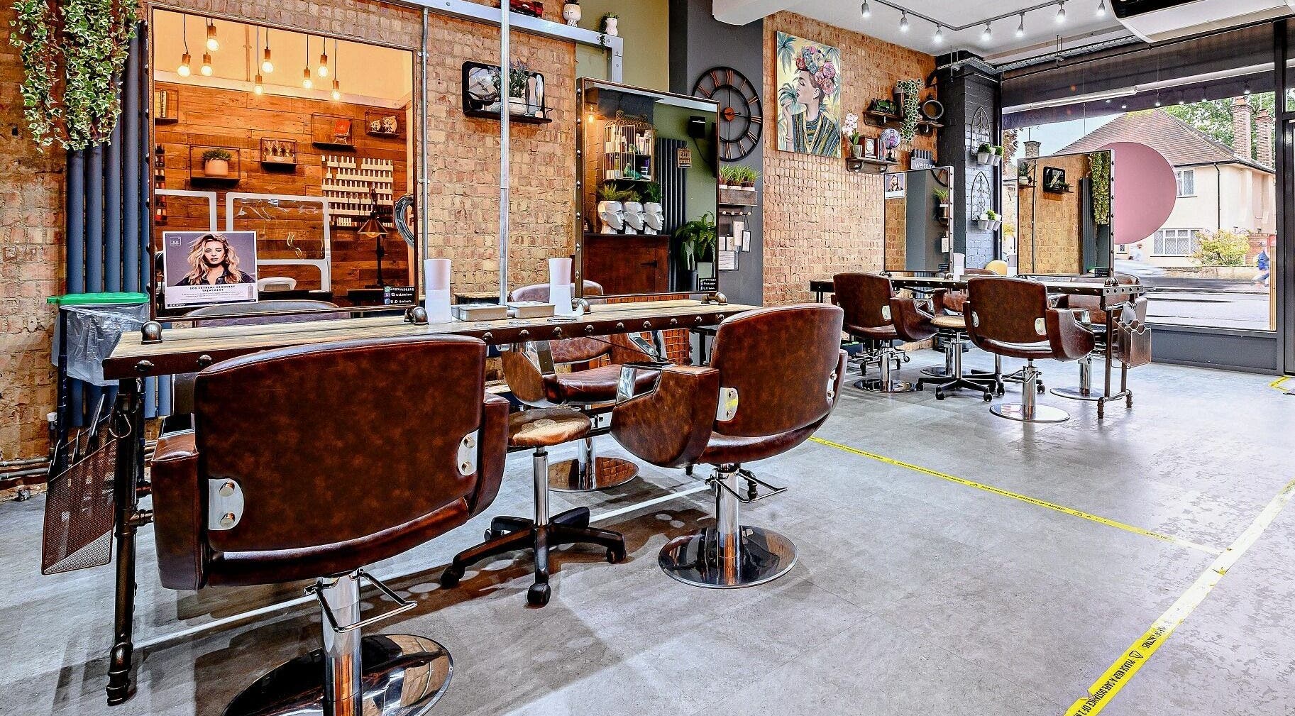 Elegant interior of U.D Hair & Beauty Lounge in Watford, England, GB showcasing chic salon setup.