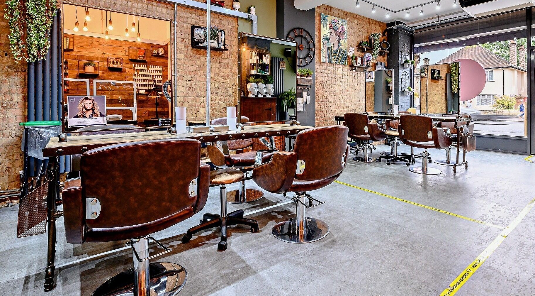 Elegant interior of U.D Hair & Beauty Lounge in Watford, England, GB showcasing chic salon setup.