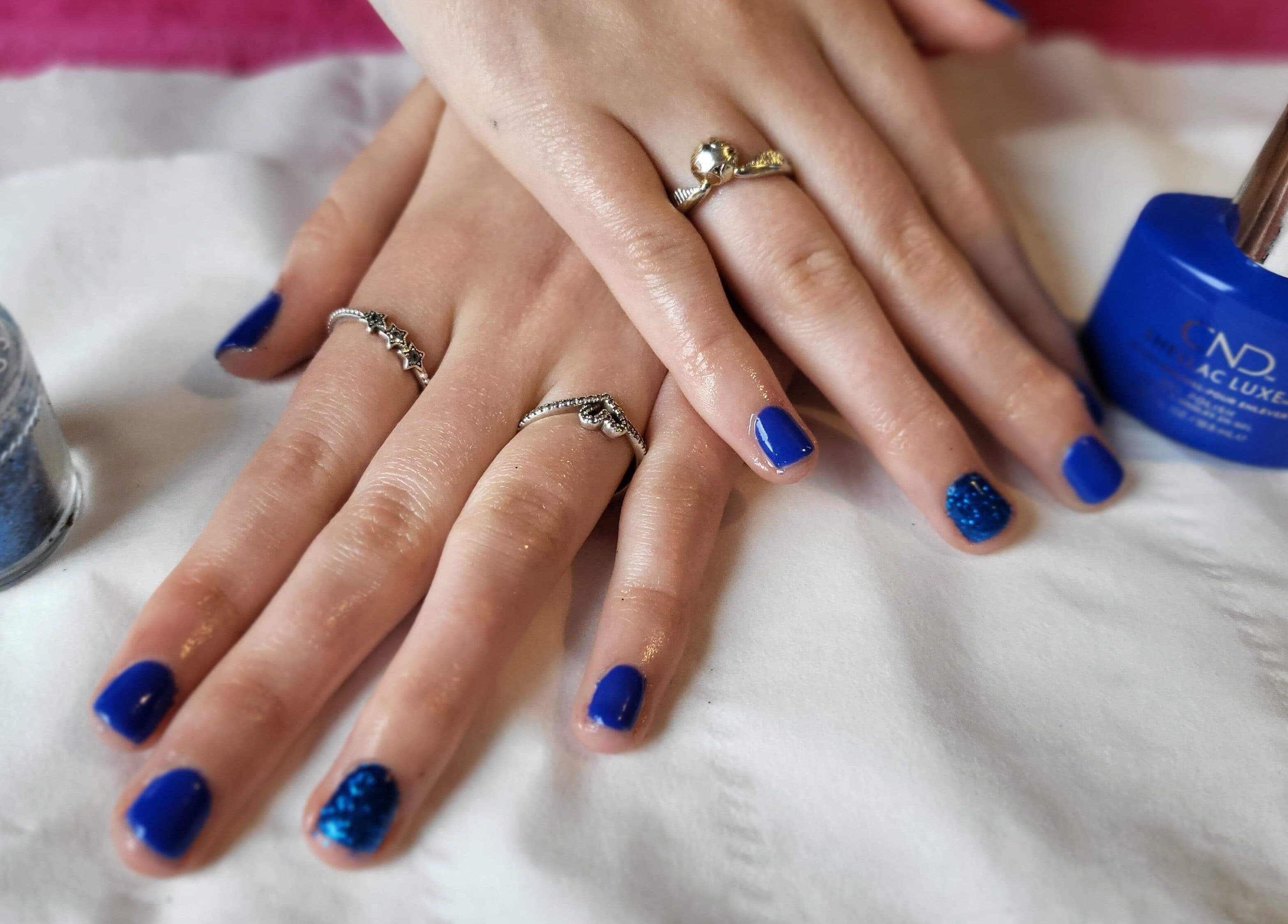 Stunning blue manicure at Beauty and Beyond, Greenock, Scotland, GB, showcasing elegance and style.