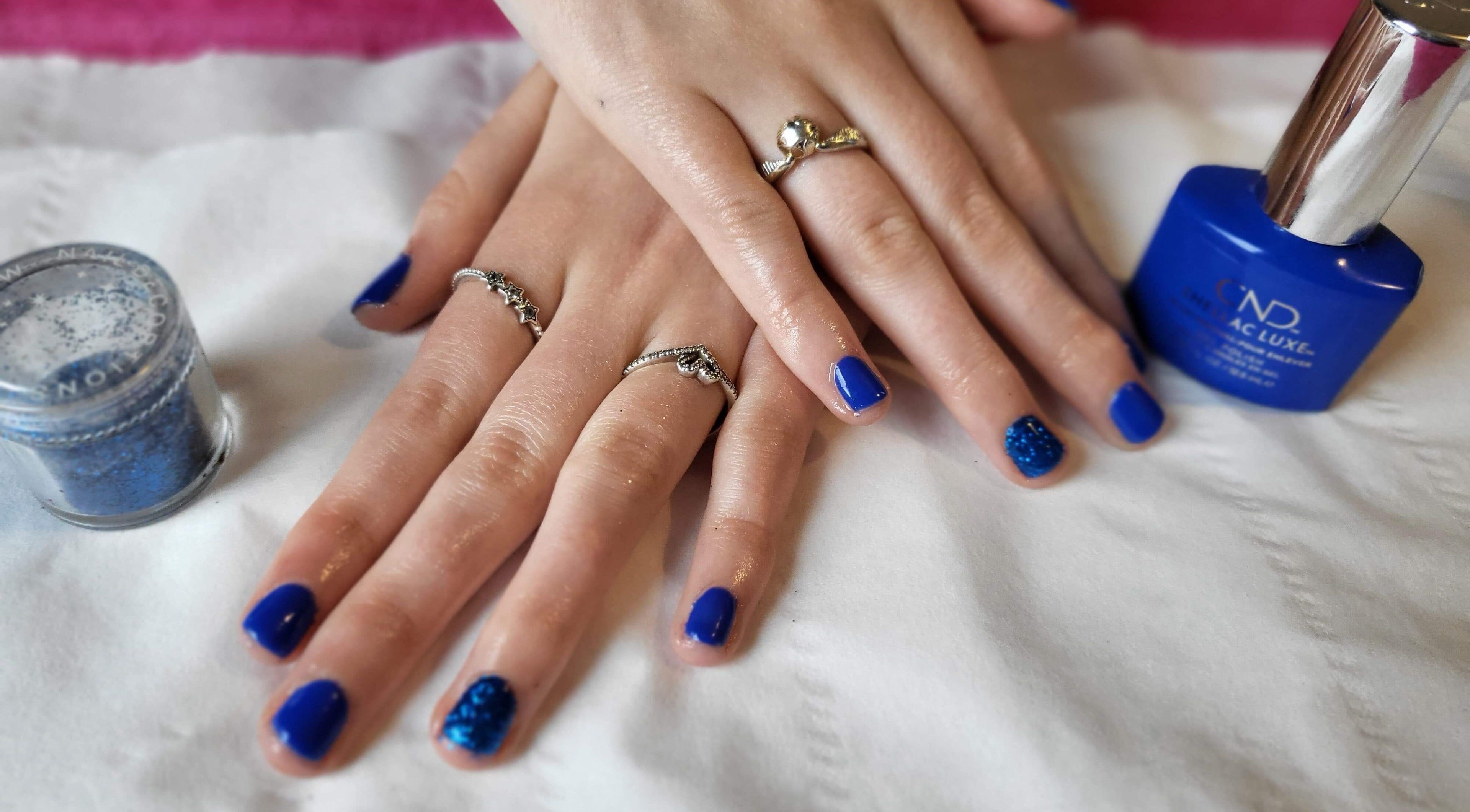 Stunning blue manicure at Beauty and Beyond, Greenock, Scotland, GB, showcasing elegance and style.