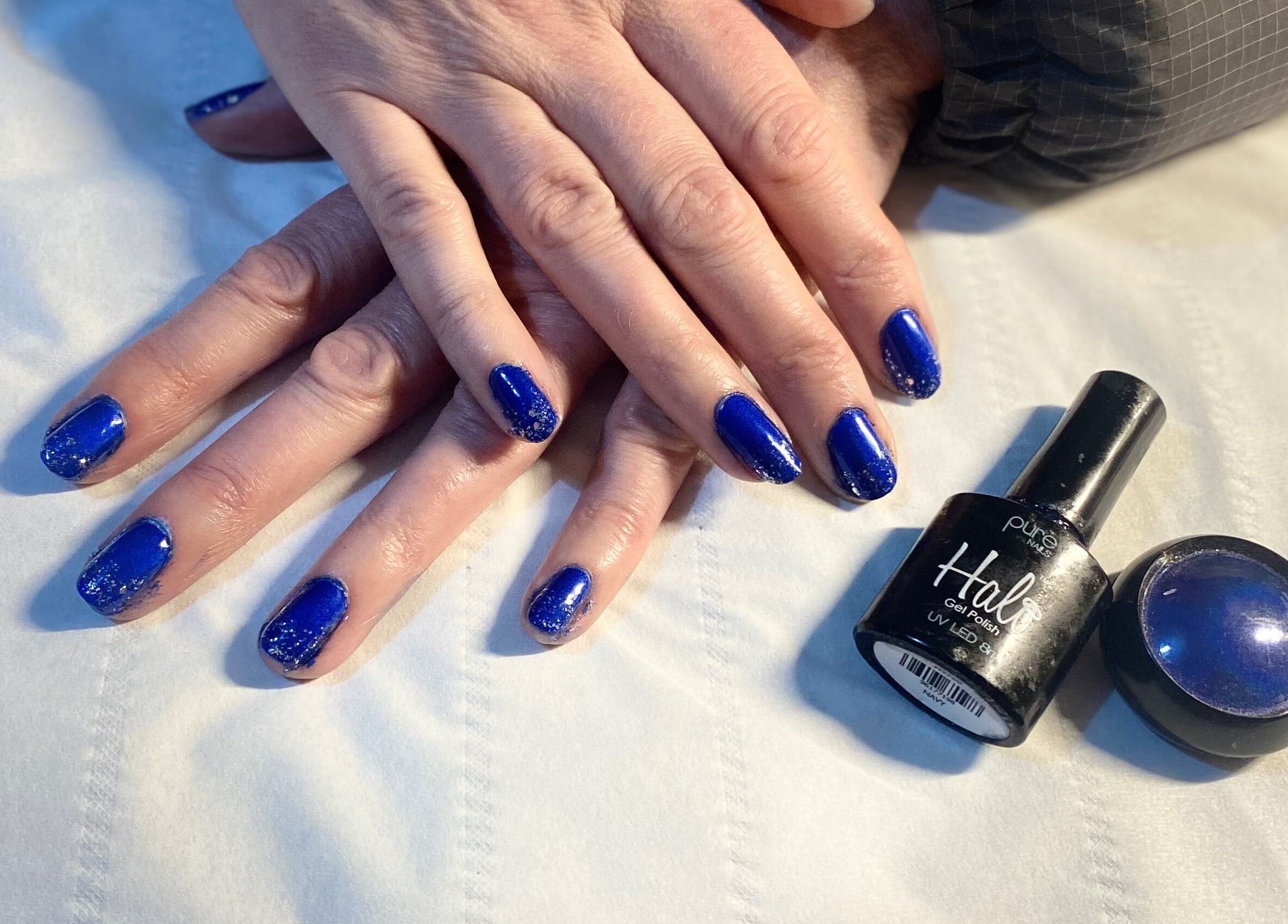 Stunning blue gel manicure at Beauty and Beyond, Greenock, Scotland, GB, showcasing elegant nail art.