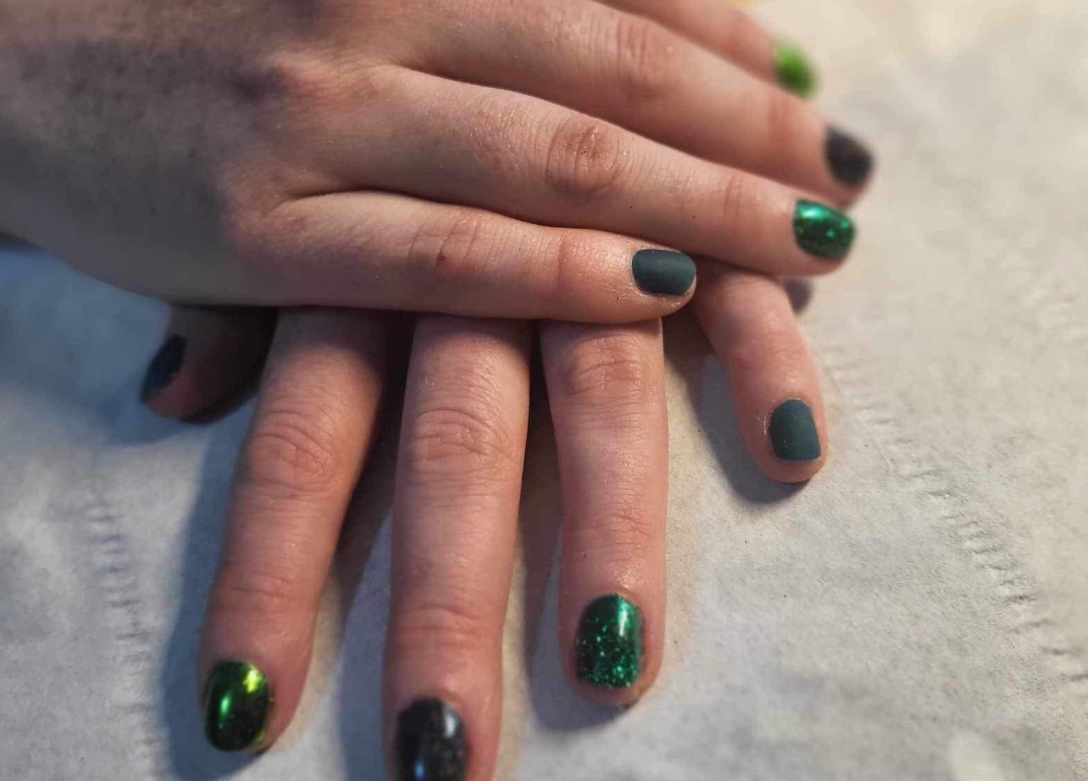 Beautiful manicure at Beauty and Beyond, Greenock, Scotland, GB with green and black nail polish.