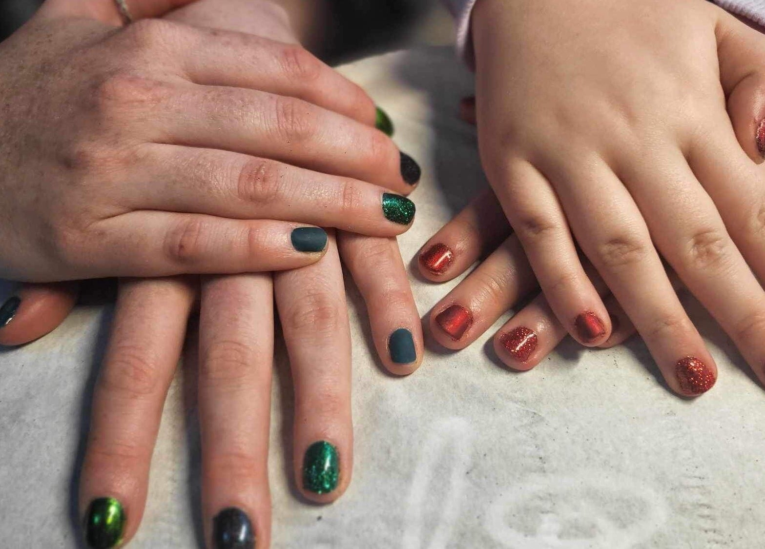Manicured hands with colorful nails at Beauty and Beyond, Greenock, Scotland, GB.