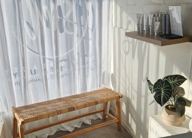 Cozy corner at SM Skin and Beauty, Strathmore, Victoria, AU with a bench and skincare products.