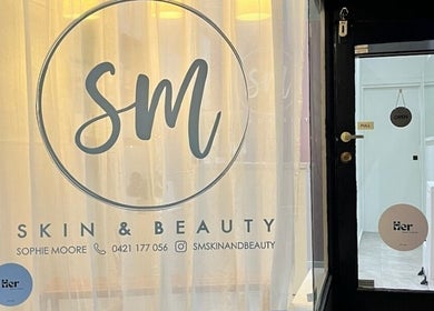 Entrance of SM Skin and Beauty in Strathmore, Victoria, AU showcasing a sleek design.