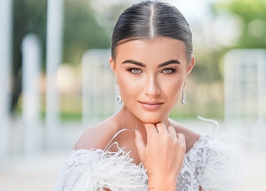 Elegant portrait of a woman at Skoonveldt, Klerksdorp, North West, ZA with sophisticated makeup and hairstyle.