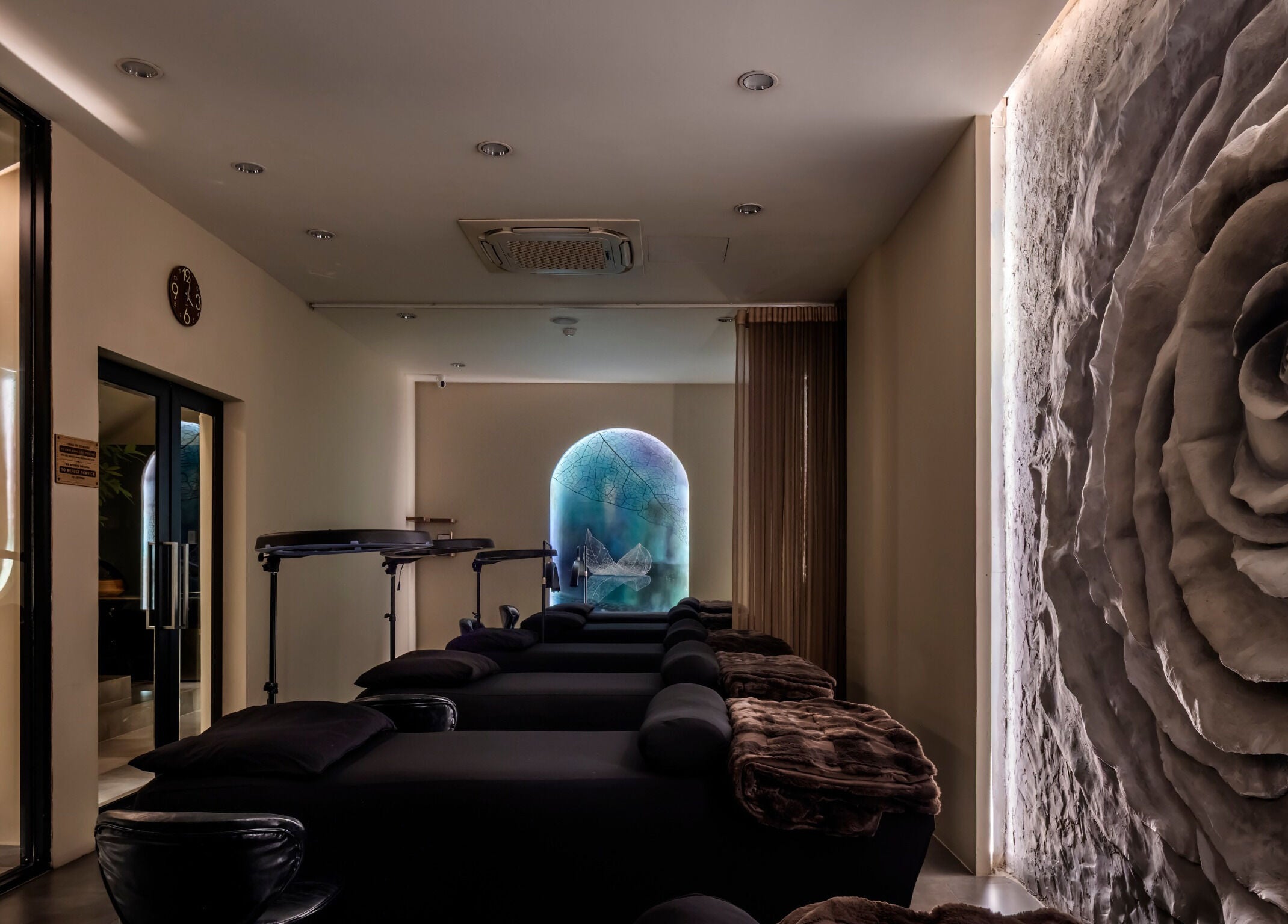 Tranquil spa lounge at NP Brows & Lashes x Ukiyo Spa in Ho Chi Minh, VN featuring elegant decor and soothing lighting.