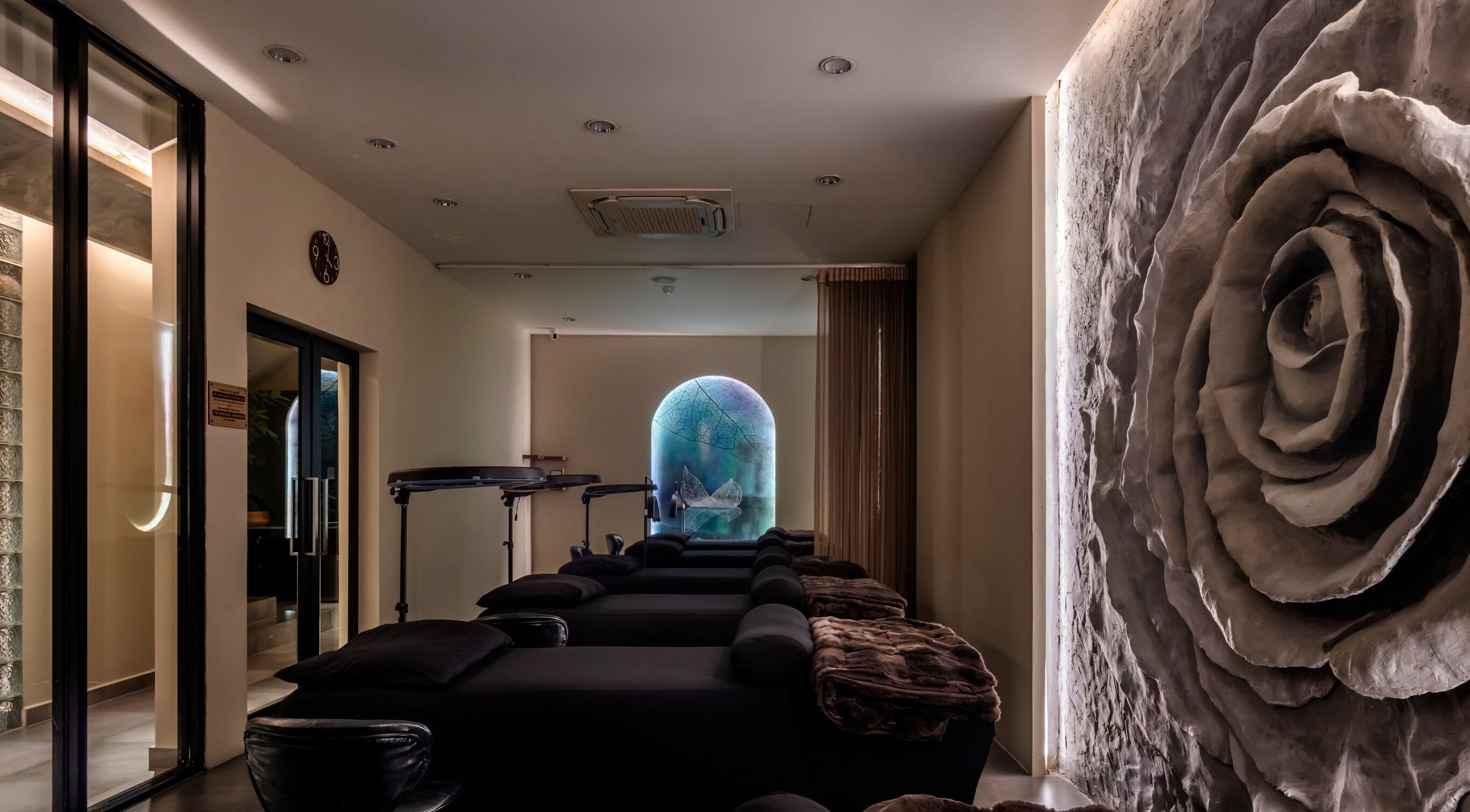 Tranquil spa lounge at NP Brows & Lashes x Ukiyo Spa in Ho Chi Minh, VN featuring elegant decor and soothing lighting.