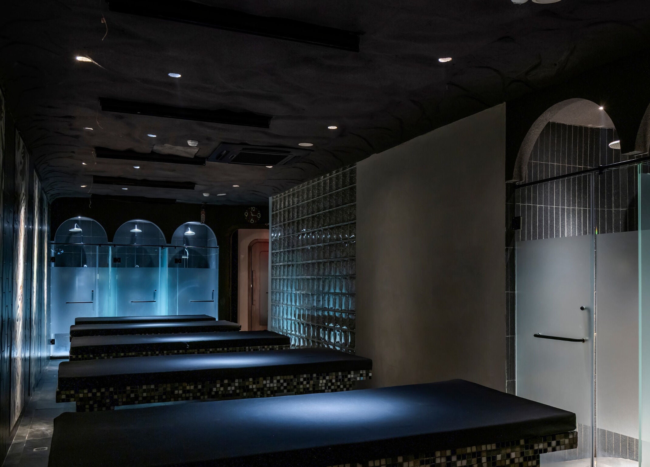 Sleek spa interior at NP Brows & Lashes x Ukiyo Spa in Ho Chi Minh, VN, featuring elegant massage tables.