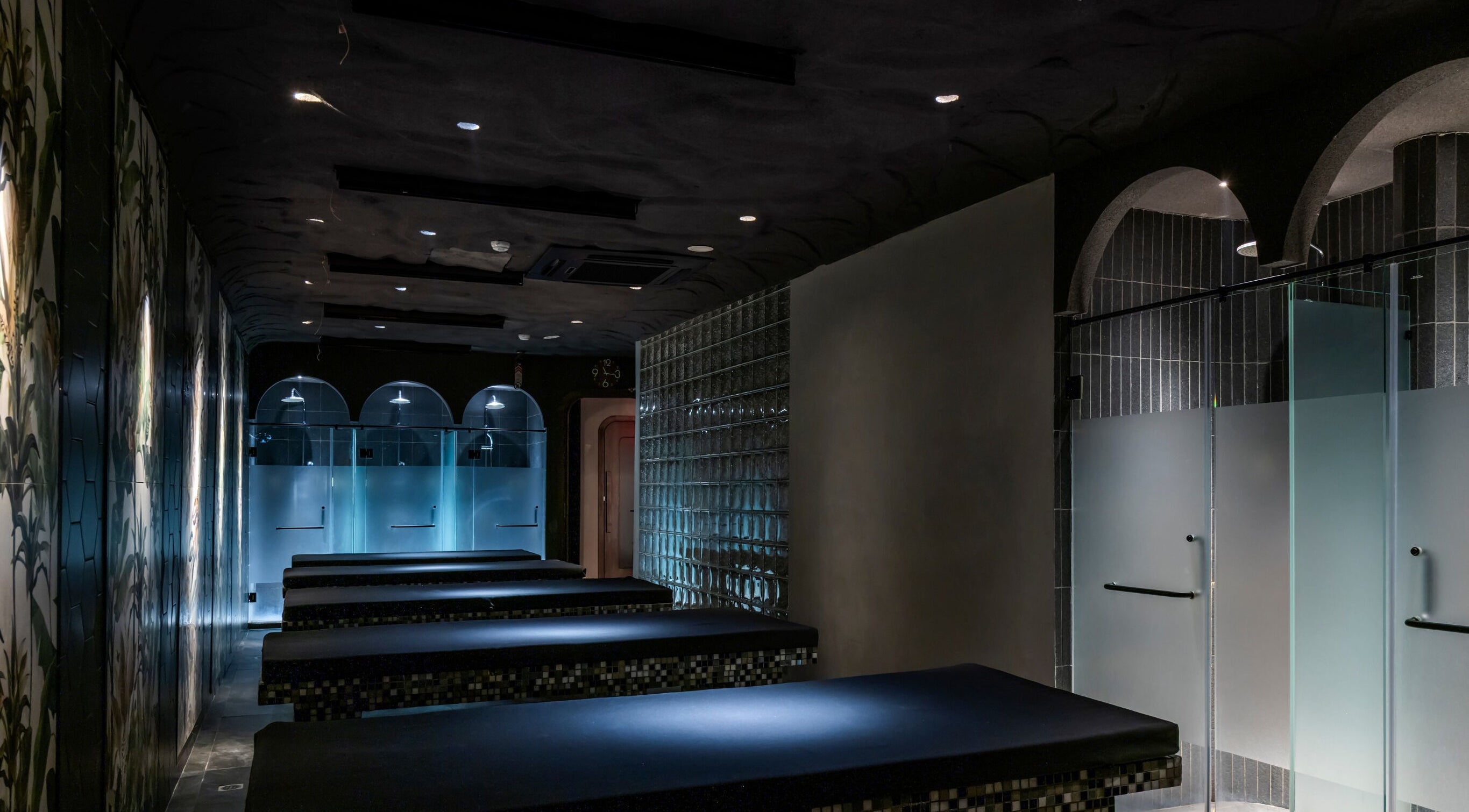 Sleek spa interior at NP Brows & Lashes x Ukiyo Spa in Ho Chi Minh, VN, featuring elegant massage tables.