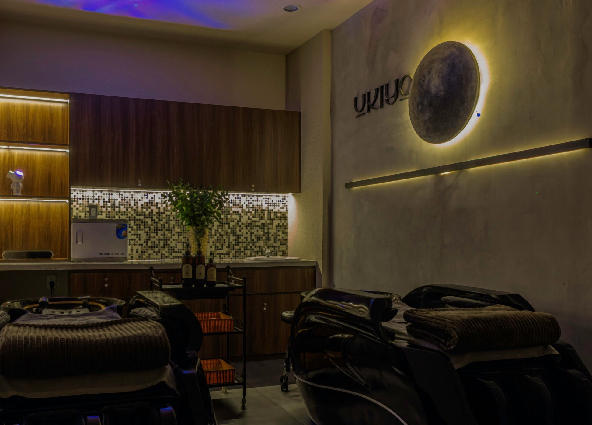 Elegant spa interior at NP Brows & Lashes x Ukiyo Spa, Ho Chi Minh, VN with ambient lighting.