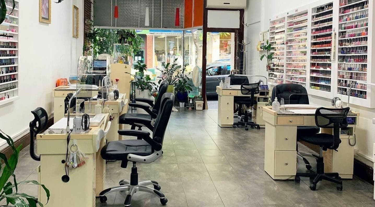 Interior of 4 Seasons Nails Lashes and Beauty in Melbourne, Victoria, AU with manicure stations and polish display.