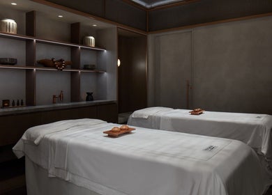 Luxurious spa room at SENSASIA Stories, Dubai, Dubai, AE with double massage tables and serene ambiance.