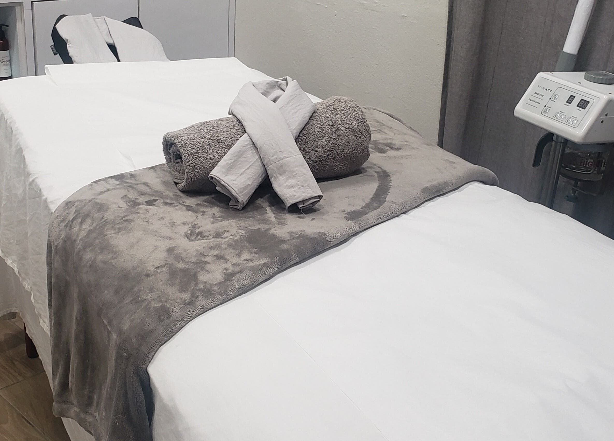 Spa bed at Skin Beautii by Waxxmii Mackey Street, Nassau, New Providence, BS. Elegant towels and modern equipment.