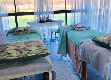 Therapy beds at Always Upstairs Day Spa @ Emerald Resort and Casino, Vanderbijlpark, Gauteng, ZA, with scenic views.