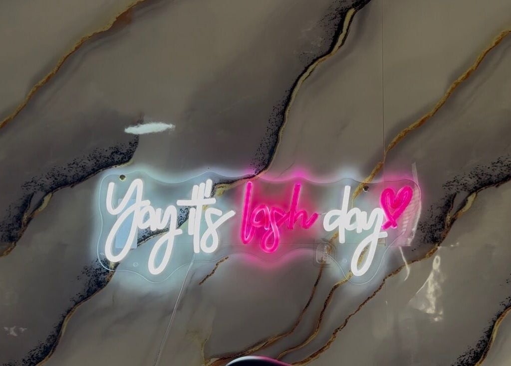 Neon sign saying 'Yay! It's lash day' at Limitless Beauty, Cape Town, Western Cape, ZA.