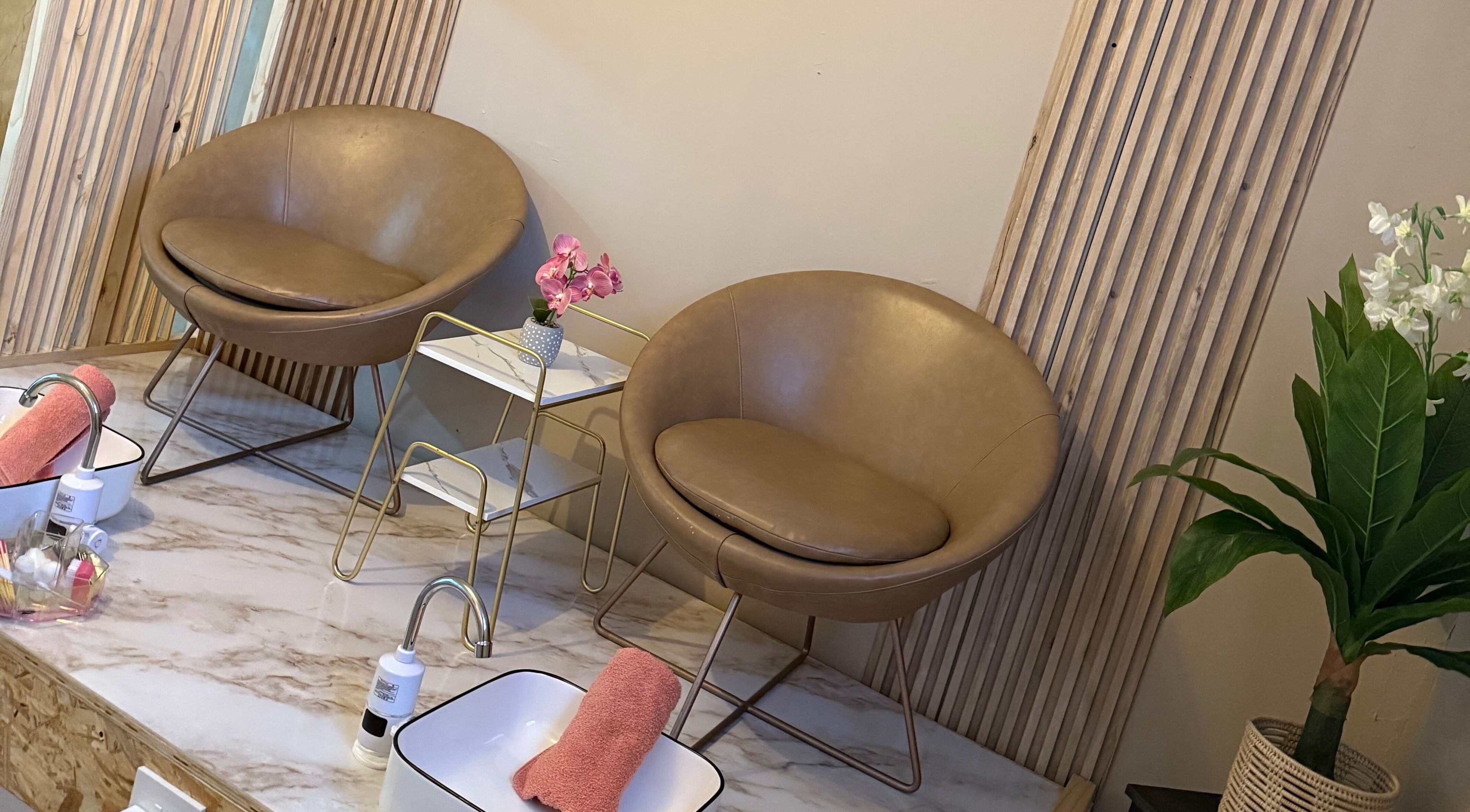 Luxury seating at Goddess Glow Pedi & Wax Bar, Cape Town, Western Cape, ZA. Elegant design and plush chairs.