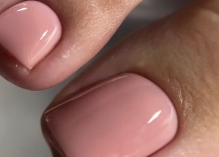 Close-up of pink polished toenails at Goddess Glow Pedi & Wax Bar, Cape Town, Western Cape, ZA.