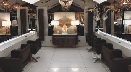 Chic interior of Hair by Kelsey Bathgate, Bawtry, England, GB featuring sleek styling stations.