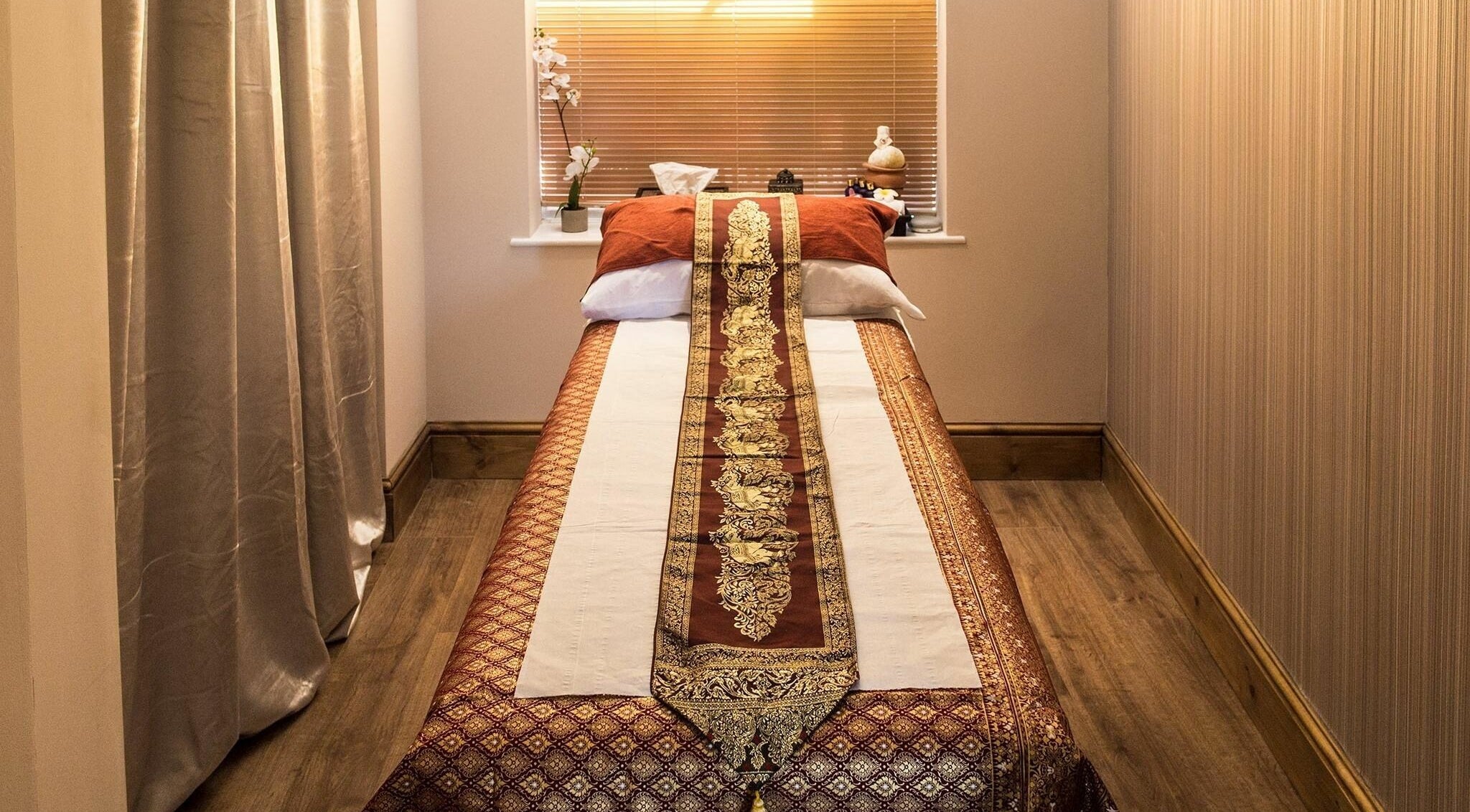 Serene massage room at Ton Poh Thai Spa and Wellness in Bristol, England, GB, featuring elegant decor.