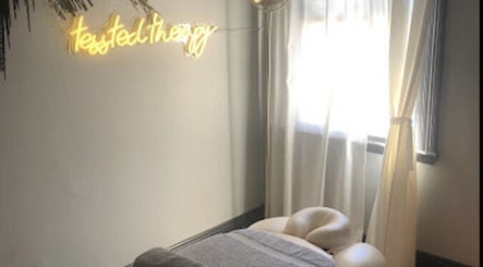 Cozy therapy room at Tessted Therapy, Alexandria, NSW, AU, featuring a massage table and soft lighting.